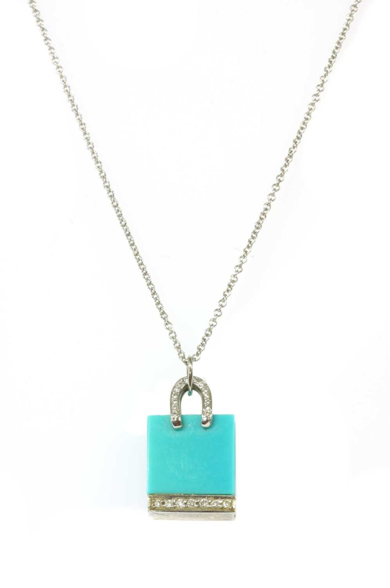A platinum turquoise and diamond shopping bag pendant/charm by Tiffany & Co.,