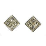 A pair of white gold diamond earrings,