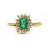 An 18ct gold emerald and diamond cluster ring,