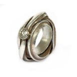 A fine silver single stone diamond ring by Michael Carberry,