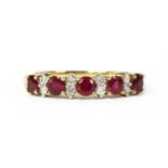 A gold ruby and diamond half eternity ring,