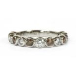 A platinum diamond half eternity ring,