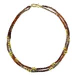 A two row gold and assorted gemstone bead necklace,