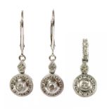 A white gold diamond cluster pendant and earrings suite,