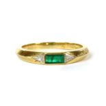 An 18ct gold emerald and diamond three stone ring,