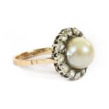 A gold and silver, cultured pearl and diamond cluster ring,