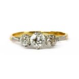 A gold and platinum three stone diamond ring,