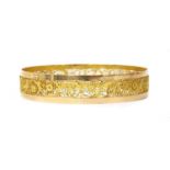 A gold filigree bangle,