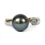 An 18ct white gold cultured pearl and diamond torque ring,