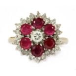 A white gold diamond and ruby target cluster ring,