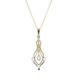 An Edwardian gold aquamarine and split pearl pendant,