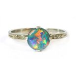 A black opal and diamond ring,