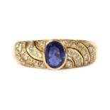 A gold sapphire and diamond ring,