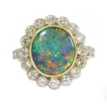 A gold boulder opal and diamond cluster ring,