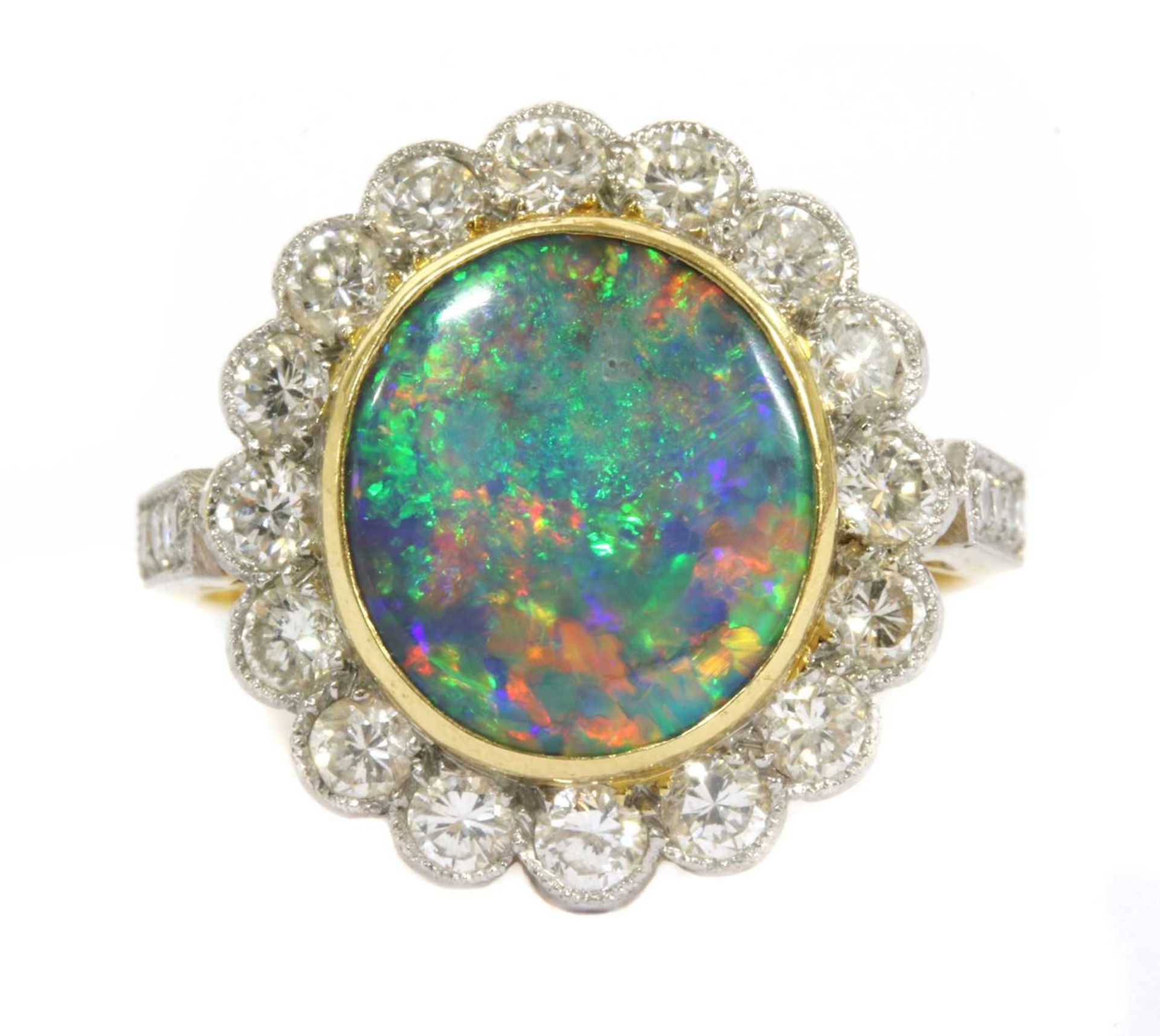 A gold boulder opal and diamond cluster ring,