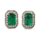 A pair of white gold emerald and diamond cluster earrings,