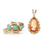 A gold three stone turquoise ring,