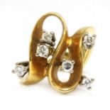 A gold diamond set wave head ring, c.1970,