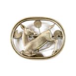 A sterling silver kneeling deer brooch, by Georg Jensen,