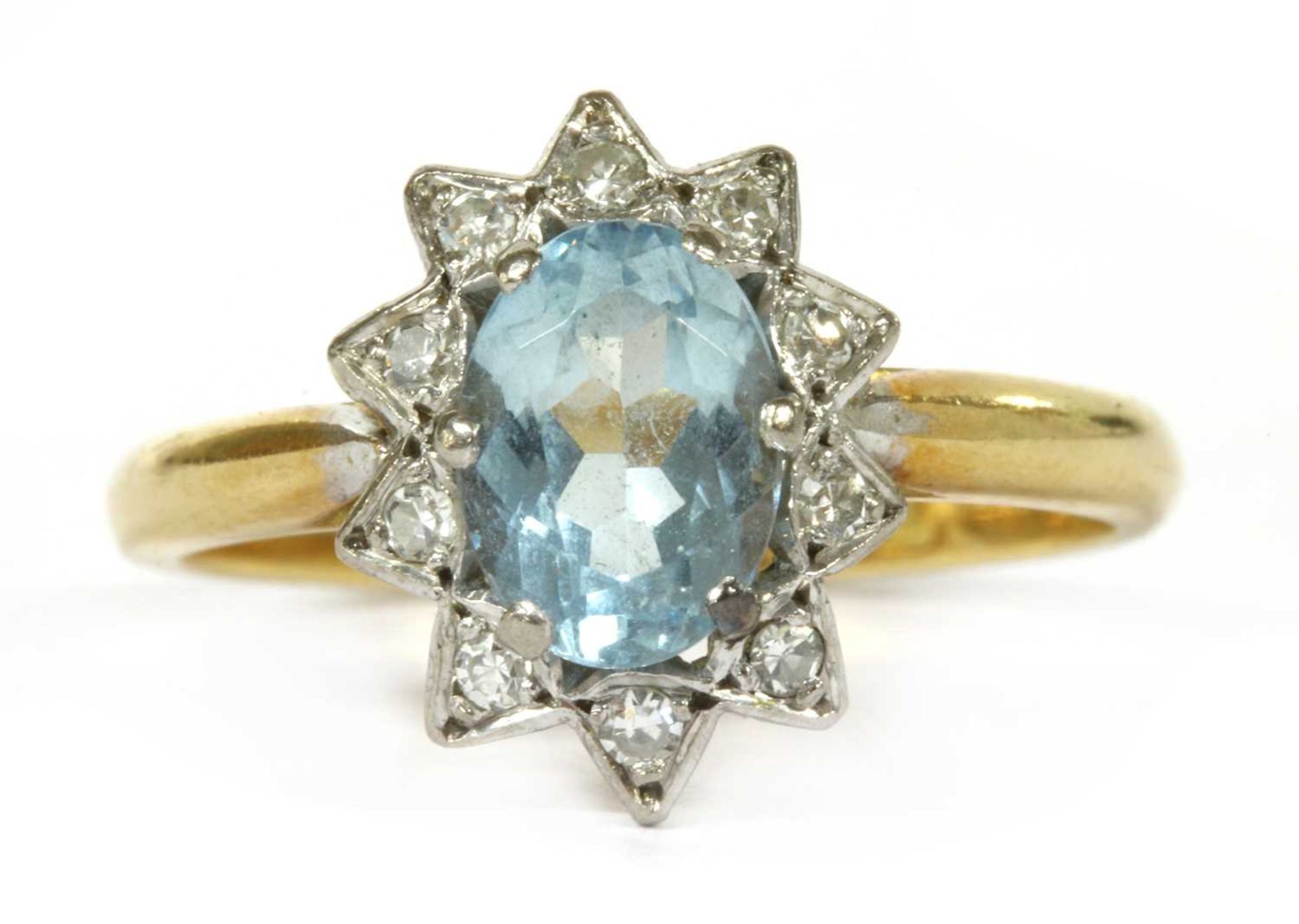 A gold aquamarine and diamond cluster ring,