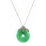 A white gold jadeite jade bi and diamond pendant,