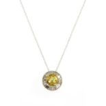A white gold yellow sapphire and diamond cluster pendant,