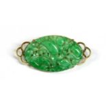 A Dutch gold mounted pierced nephrite plaque brooch, c.1925,