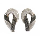 A pair of white gold diamond and black diamond earrings,