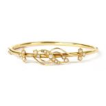 A Victorian gold split pearl hinged bangle,