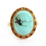 A gold single stone cabochon turquoise ring,