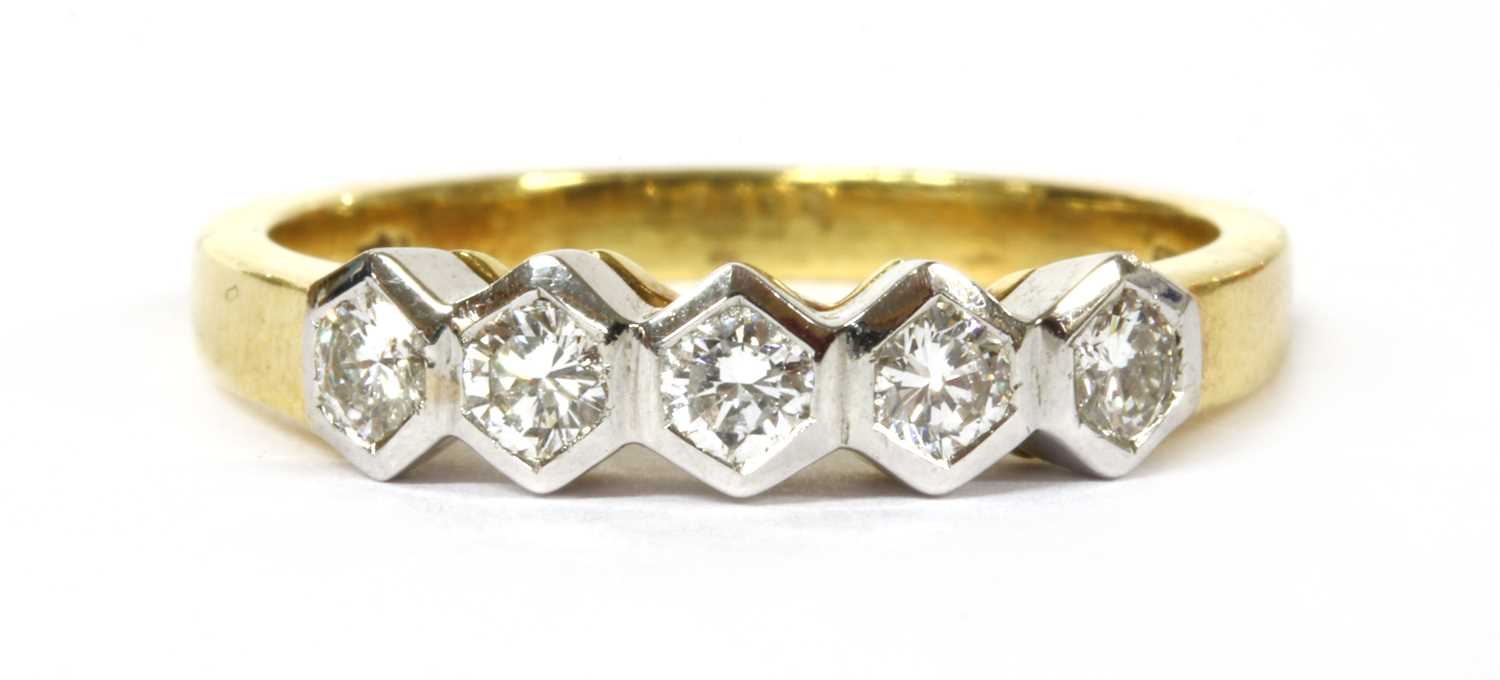 An 18ct gold five stone diamond ring,