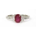 An 18ct white gold ruby and diamond three stone ring,