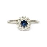 An 18ct white gold sapphire and diamond cluster ring,