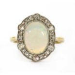 A gold opal and diamond ring,