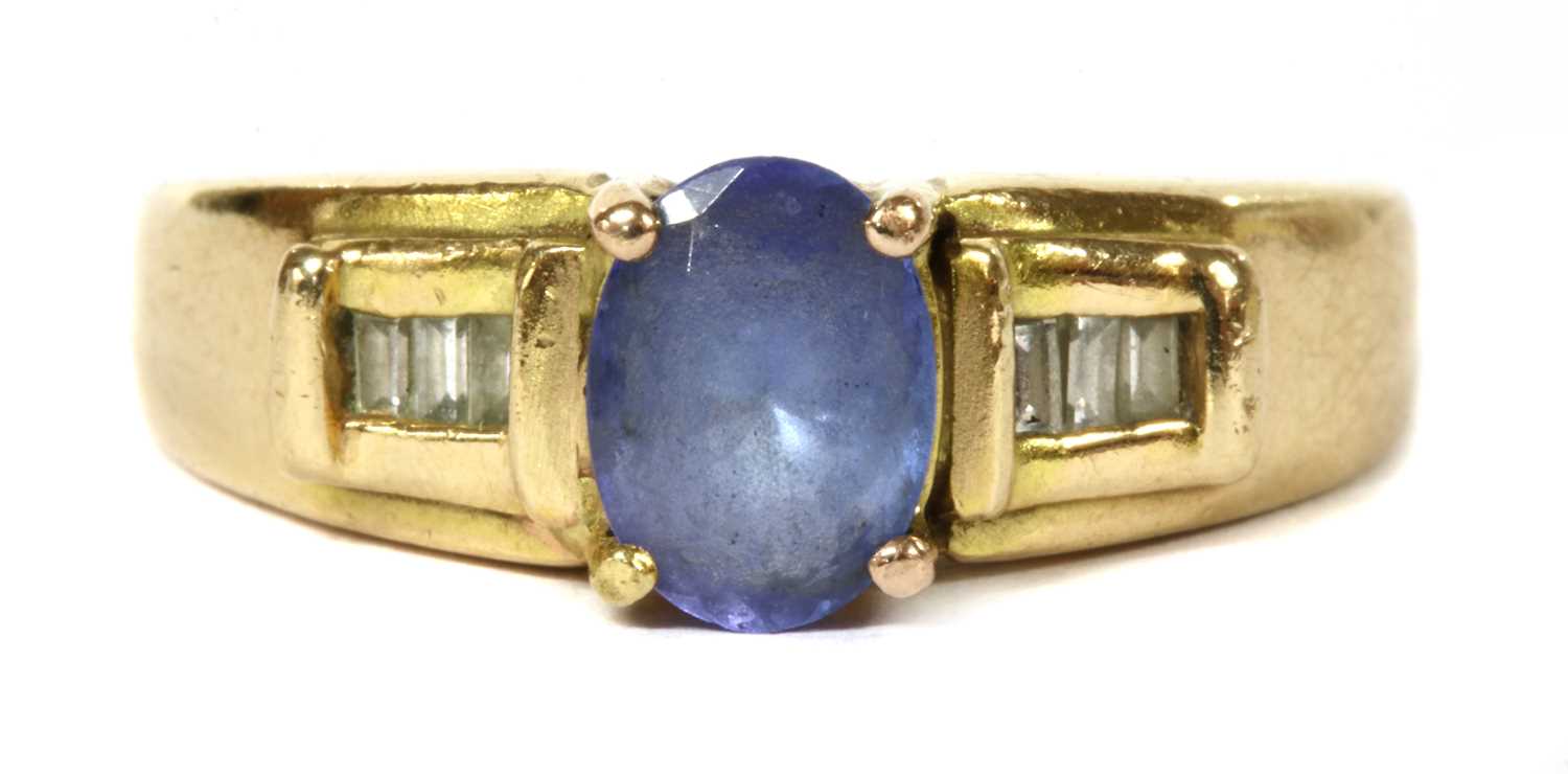 A gold iolite and diamond ring,