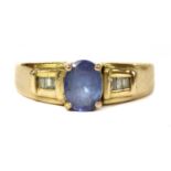A gold iolite and diamond ring,