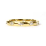 An 18ct gold marquise cut diamond full eternity ring,