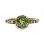 A gold peridot and diamond ring,