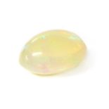 An unmounted oval cabochon opal,