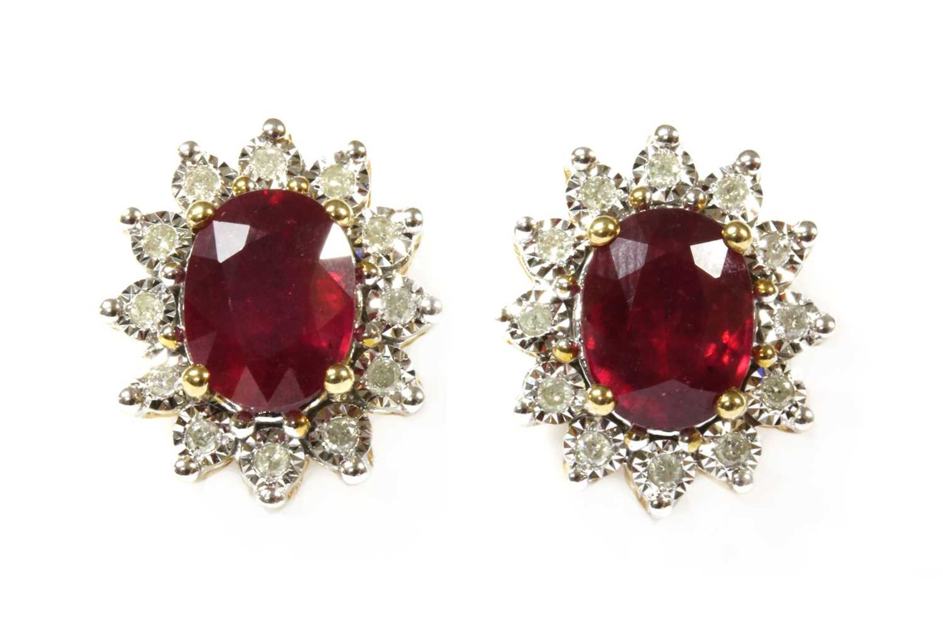 A pair of gold ruby and diamond cluster earrings,
