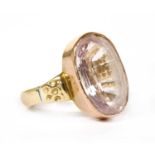 A gold single stone pink topaz ring,
