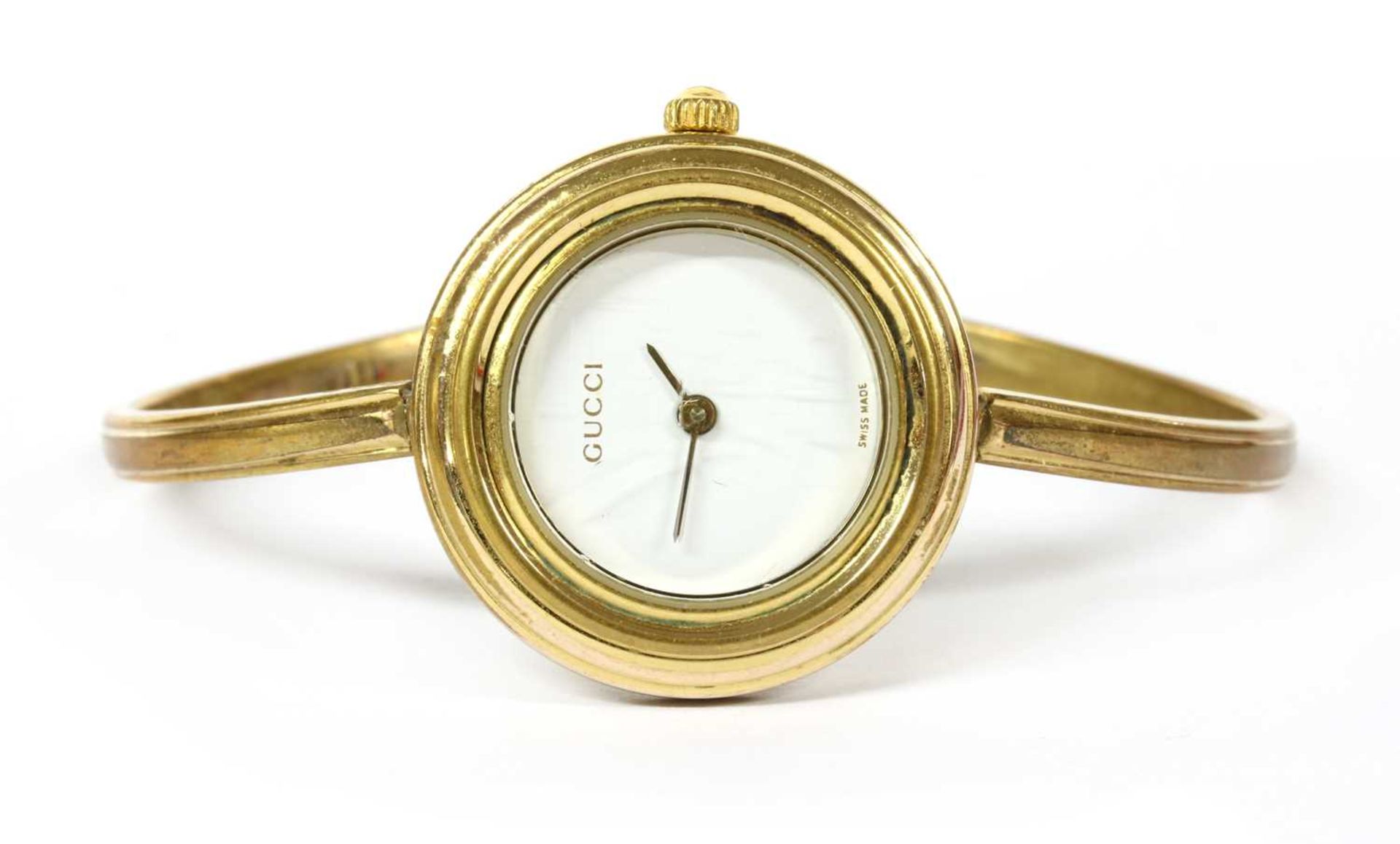 A ladies' gold-plated Gucci quartz bangle watch,