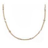 A gold pearl set chain,