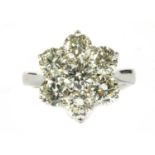 An 18ct white gold diamond daisy cluster ring,