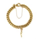 A gold curb link bracelet,