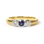 A gold sapphire and diamond three stone ring,