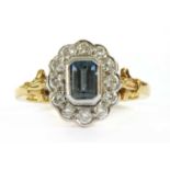 An 18ct gold aquamarine and diamond cluster ring,