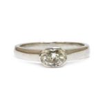 An 18ct white gold single stone oval cut diamond ring,