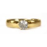 A gold single stone diamond ring,