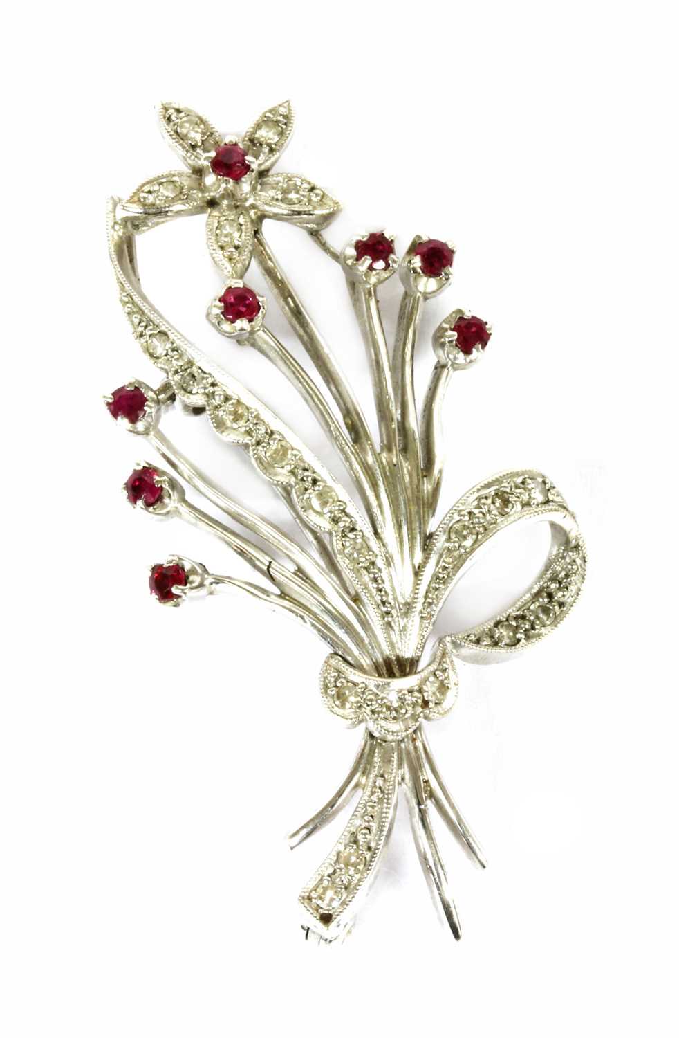 An 18ct white gold ruby and diamond floral spray brooch, c.1960,